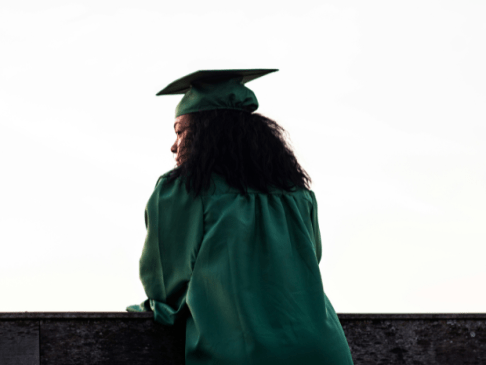 College graduate in cap and gown